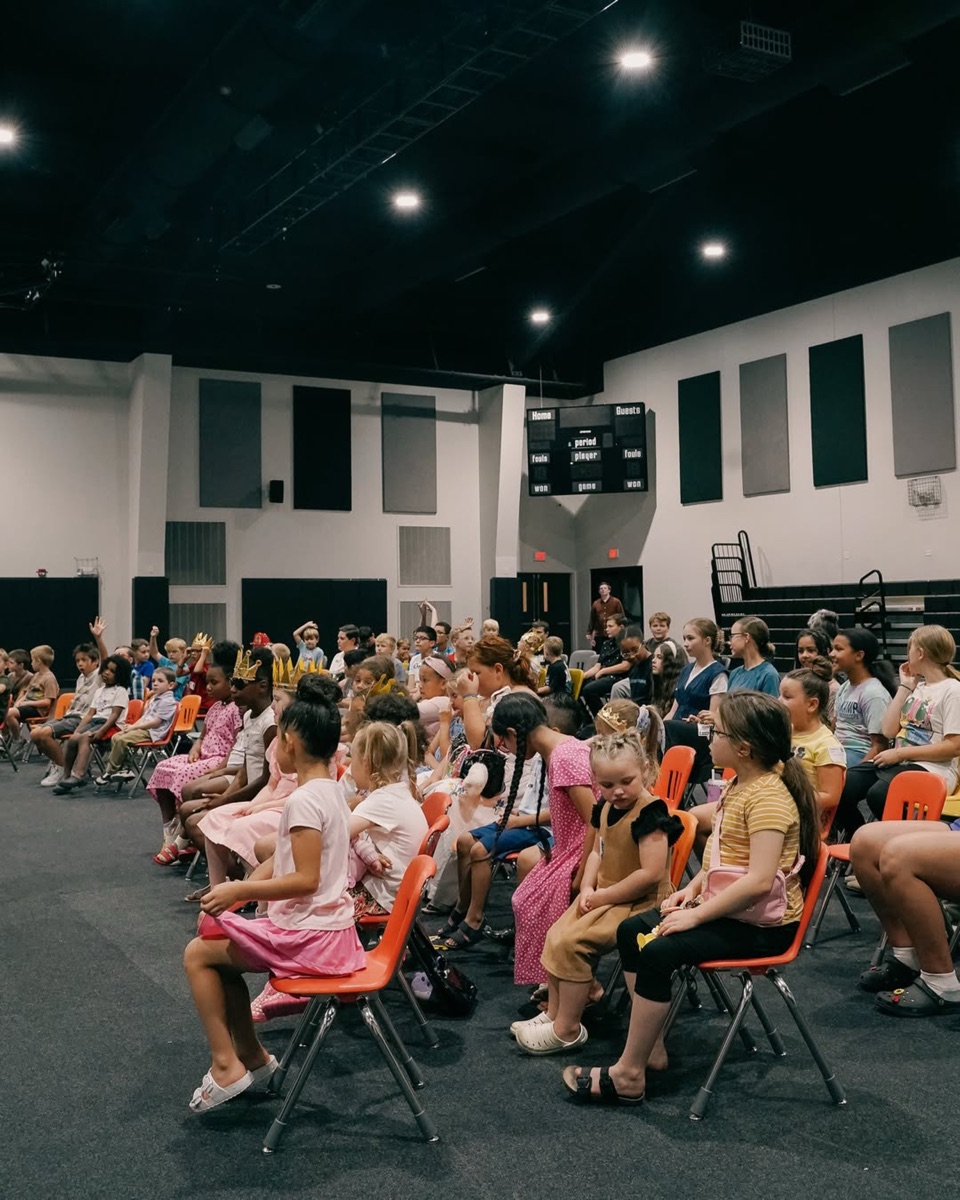 Kids church at New Life, the room full and every chair facing the front