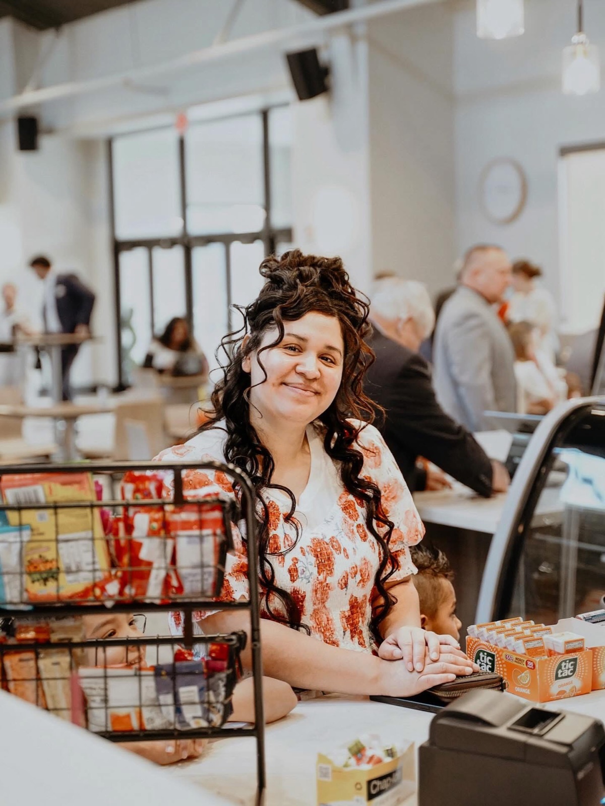 A smiling hostess serving at the New Life cafe